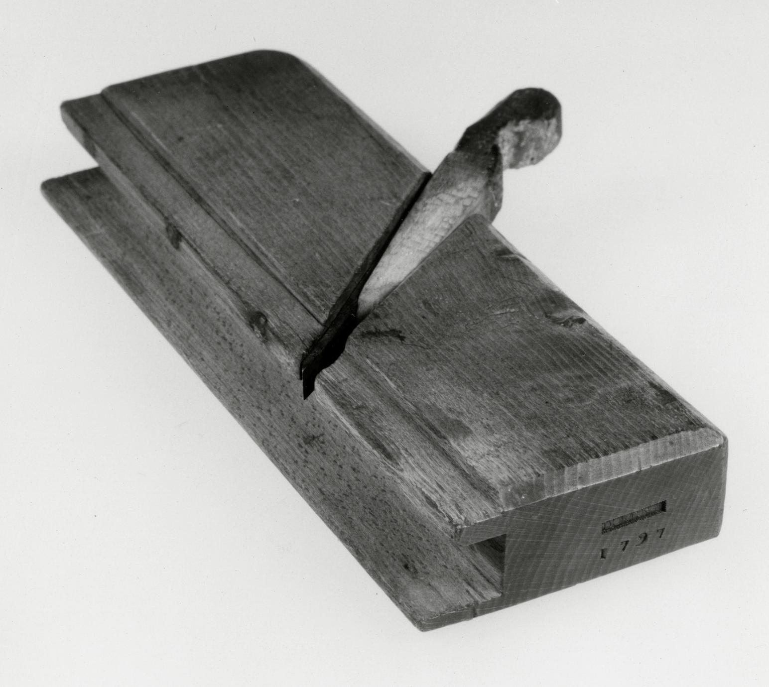 Black and white photograph of a plow and rabbet plane.