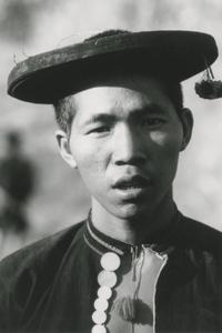 An Akha young man poses in a traditional hat in Houa Khong Province