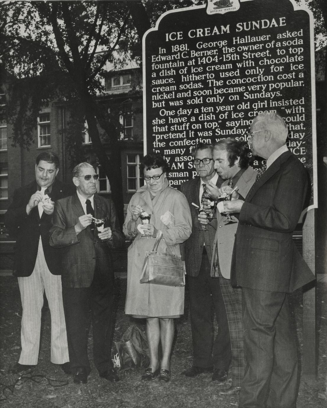 People of Two Rivers standing in front of Ice Cream Sundae historical marker