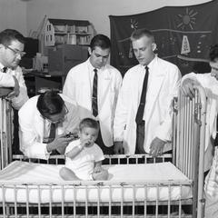 Doctors examine a small boy