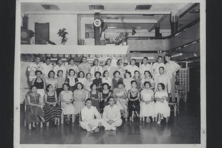Rows of classmates of former cadets and their friends at a reunion many years after graduation