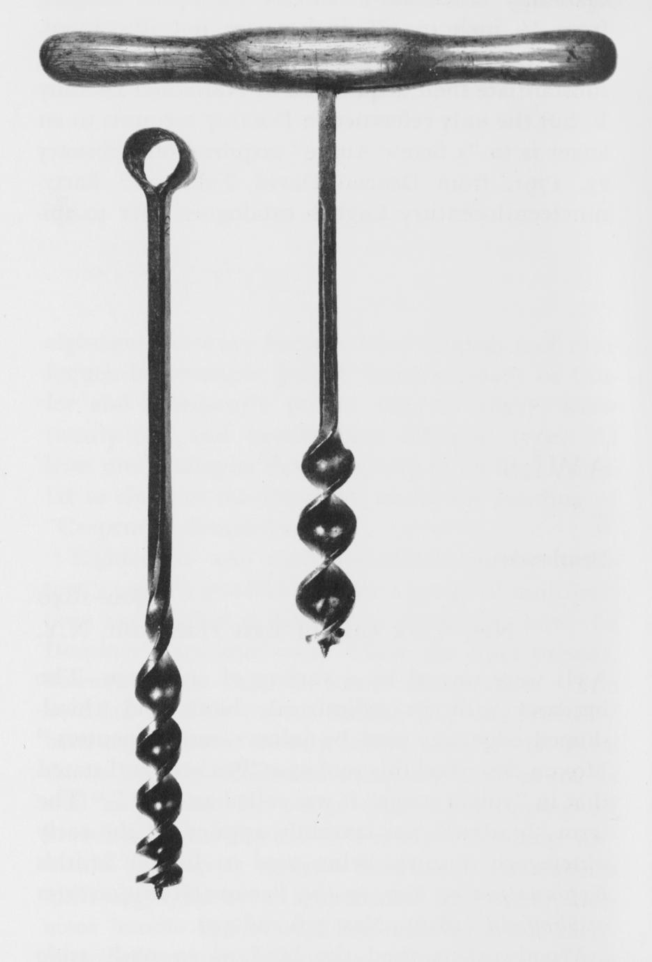 Black and white image of two augers, one with a handle and one without.
