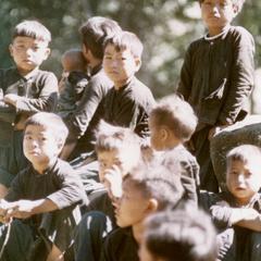 White Hmong boys watching village games in Houa Khong Province