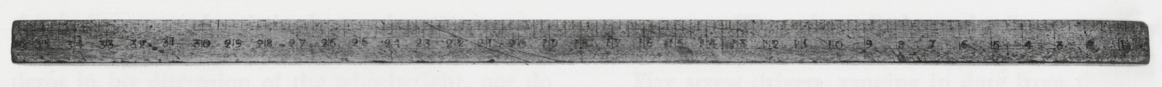 Black and white photograph of a yardstick.