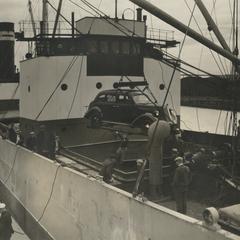 Nash cars are loaded onto a ship in the Kenosha harbor