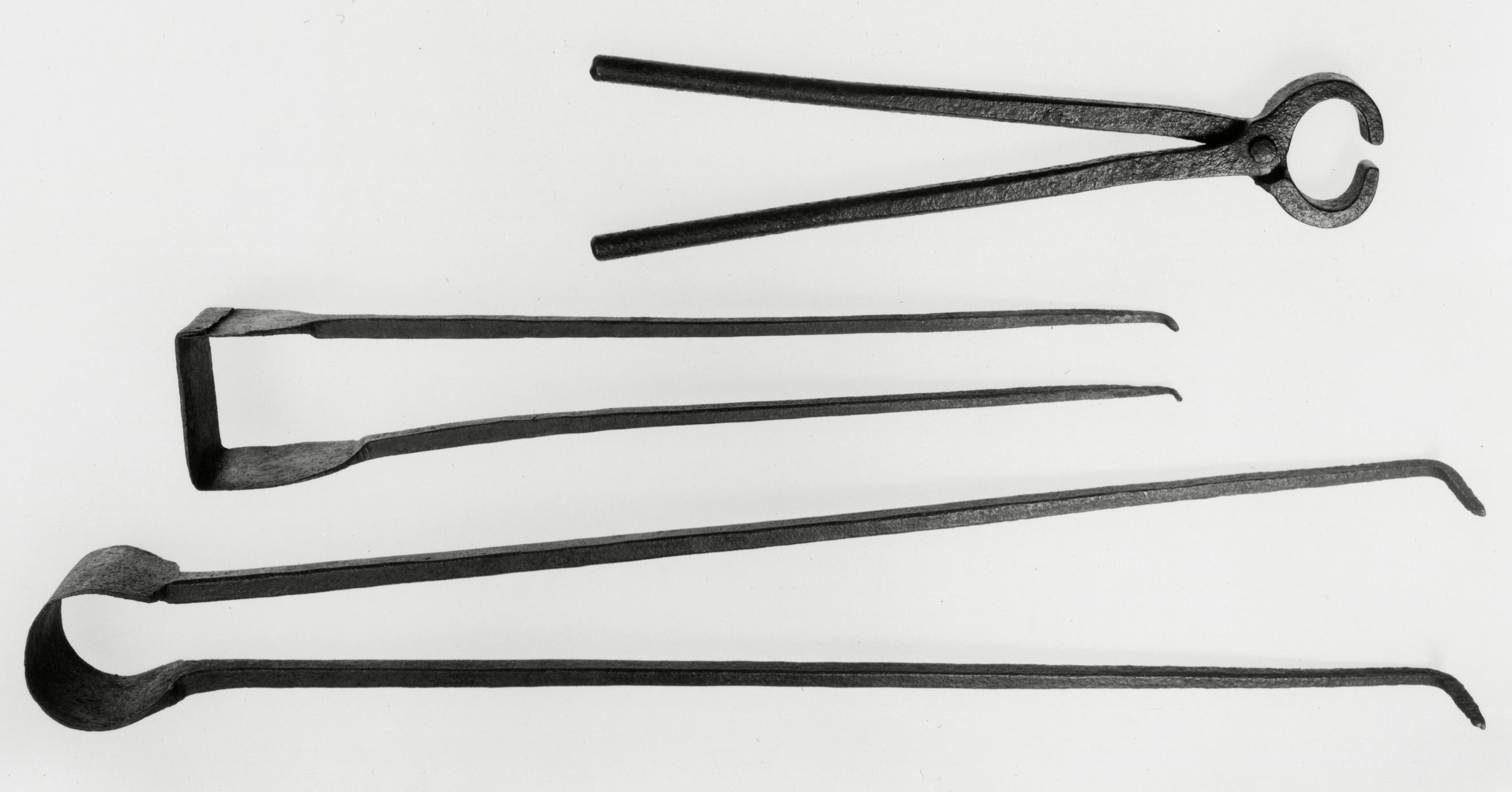 Black and white photograph of blacksmith's and metalworker's tongs.