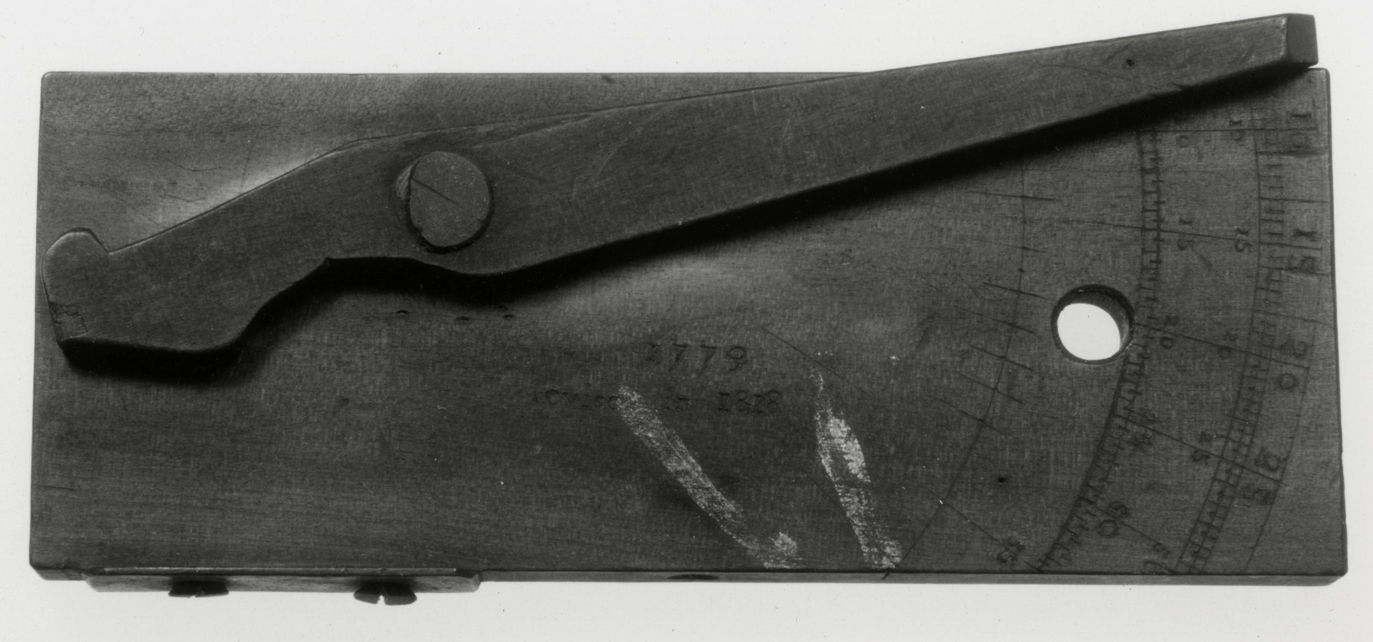 Black and white photograph of a dial-marking tool (gunsmith's tool).