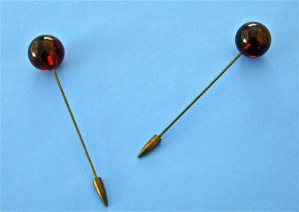 Two brown hatpins