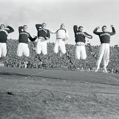 Male cheerleaders in midair