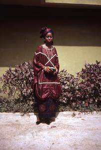 Bunmi Adeniyi in front of a house
