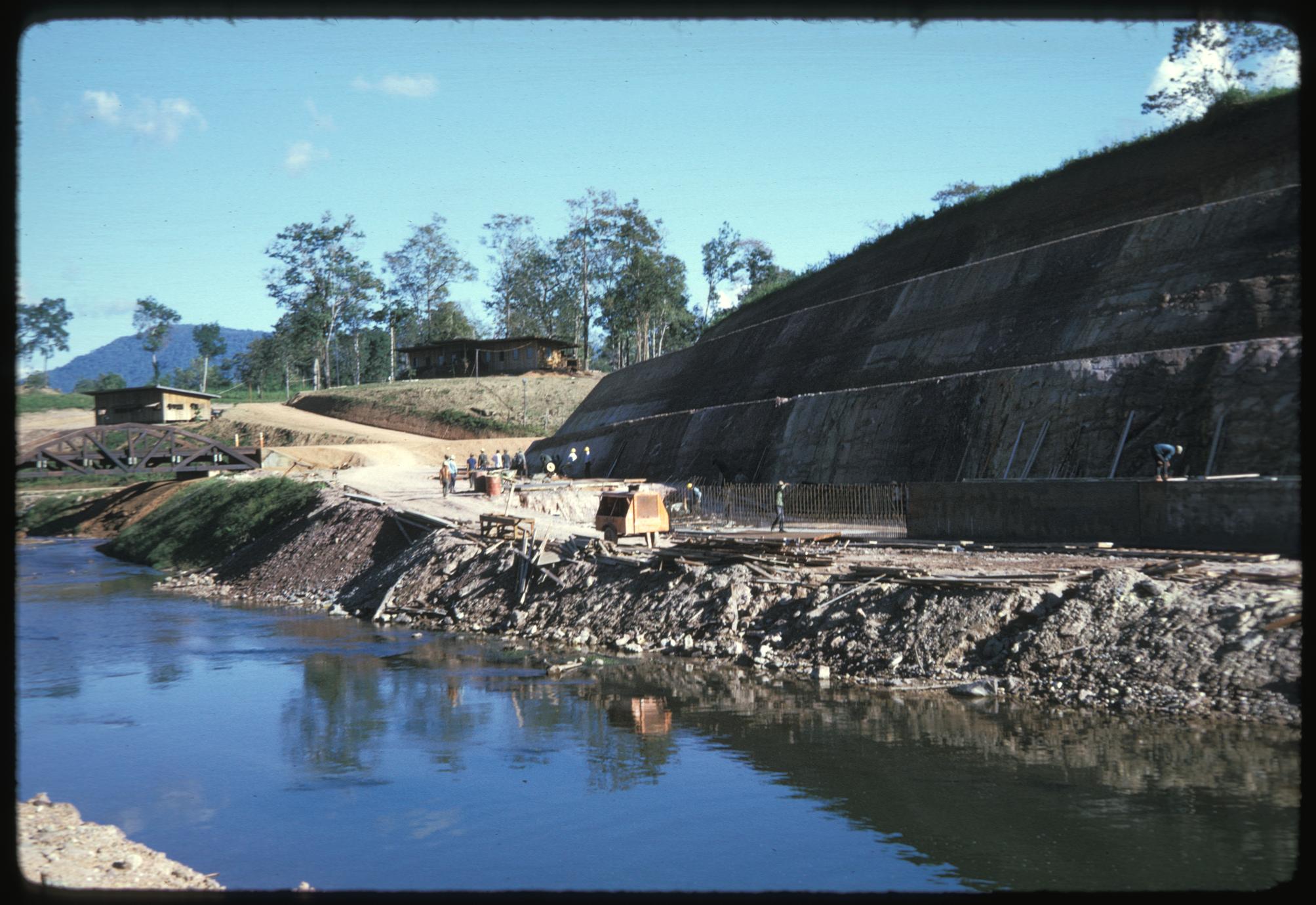 Below dam--excavating