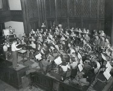 Emmett Sarig conducting band