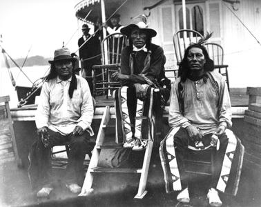 Three Native Americans on the deck of the Quincy