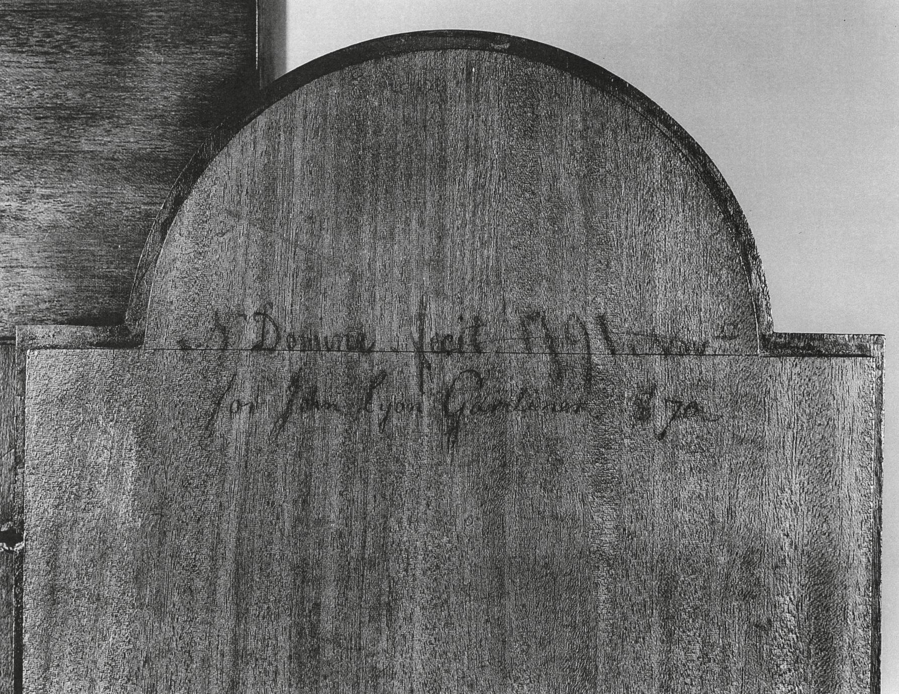 Black and white photograph of an inscription on the back of an eight-day, strike, repeater, alarm clock.