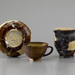 Saucer, cup, and cream pitcher
