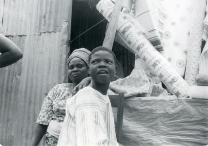 Nike's mother and Funlola with cloth