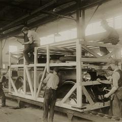 A Nash automobile is boxed for transport
