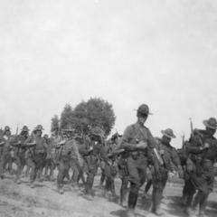 Soldiers of the US Army's 15th Infantry Regiment marching on a rural road.