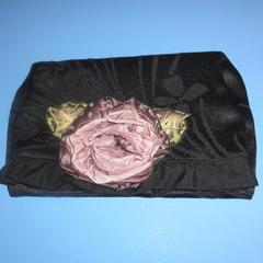 Black clutch bag with rose