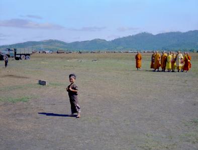 Young girl and monks in landing area