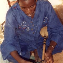Attaching the Straps to Hold the Strings of the Ngoni