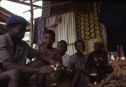 Children with cloth and kola nuts