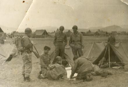 American soldiers cutting silk