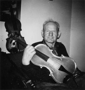 Louis Ropson with a viola he made