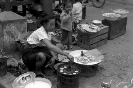 Lao cooked food vendor at market