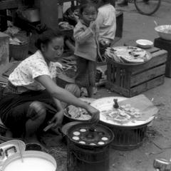Lao cooked food vendor at market