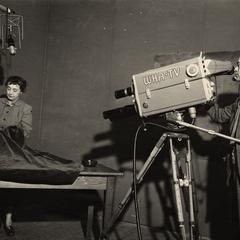 Camera trained on Aline Hazard, treating a fabric
