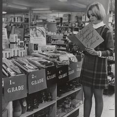 A young woman examines a school supply list