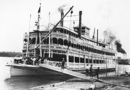 Bow side view of the G.W. Hill at landing with passengers on deck