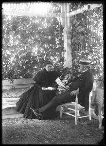 Mr. and Mrs. F. S. Newell on porch