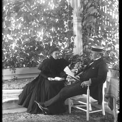 Mr. and Mrs. F. S. Newell on porch