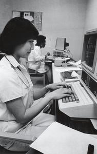 Student nurse working on a computer