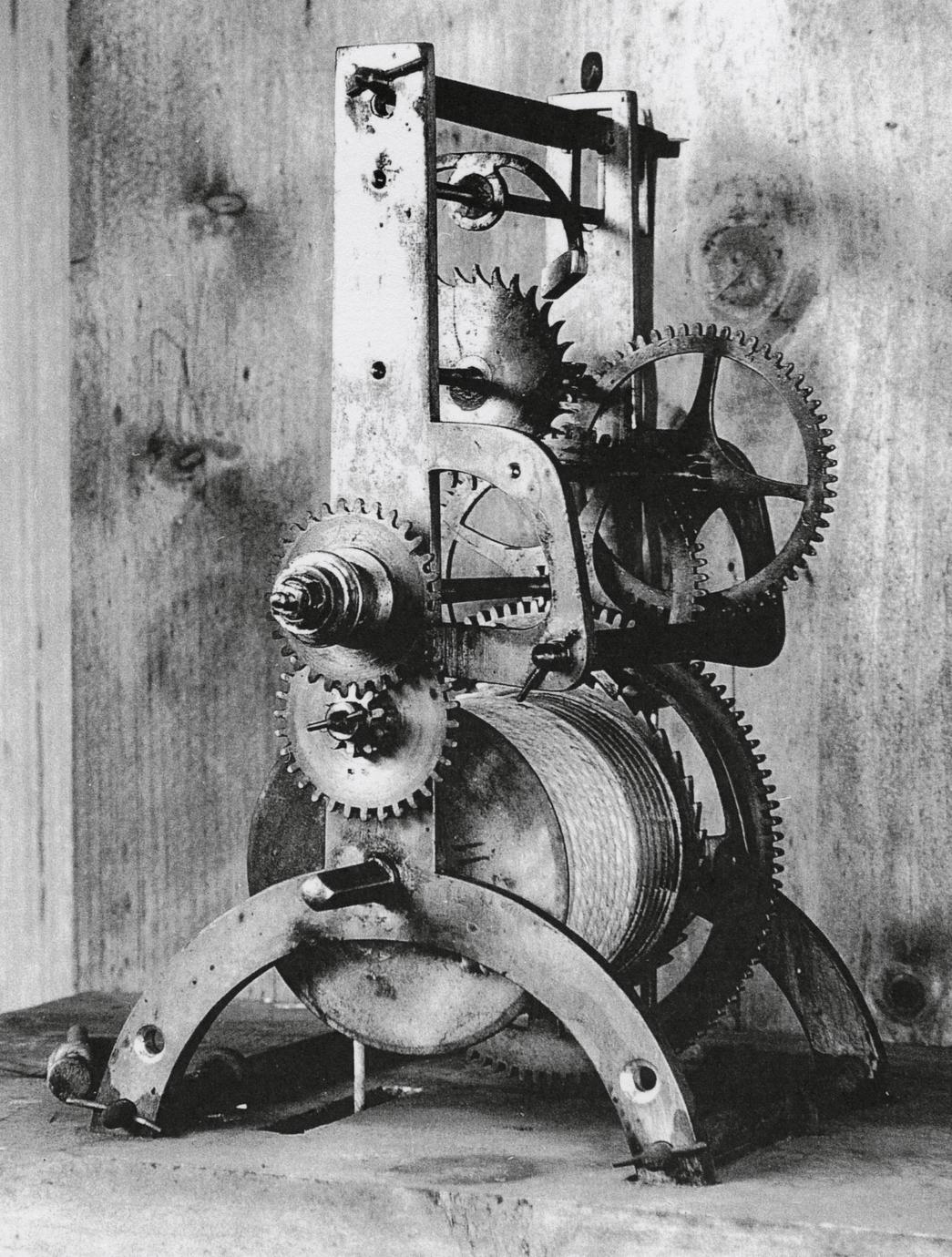 Black and white photograph of a silent clock gear system.