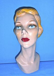 Chalk mannequin with wavy, blondish-red hair