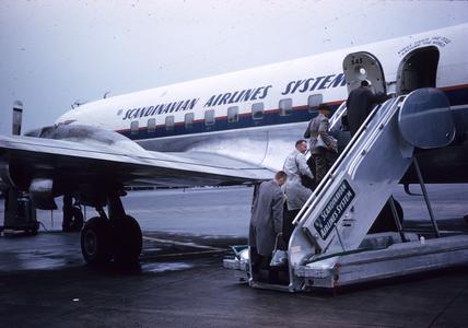 Boarding Scandinavian Airlines System plane