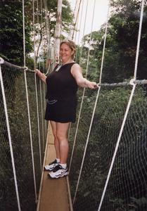 Woman on rope bridge in Kakum National Park