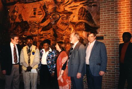 Agbo Folarin with Lillian Trager and Dick Ammann in front of his mural at UW-Parkside
