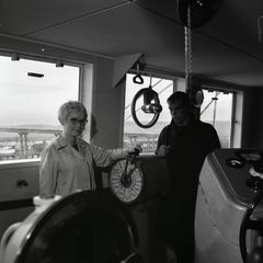 Student on boat, with navigation equipment