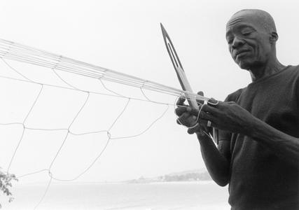 Man Making Net for Ocean Fishing