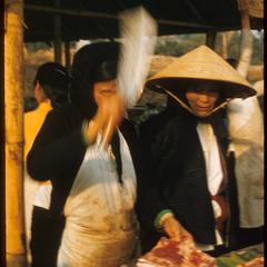 Vietnamese woman butcher at market