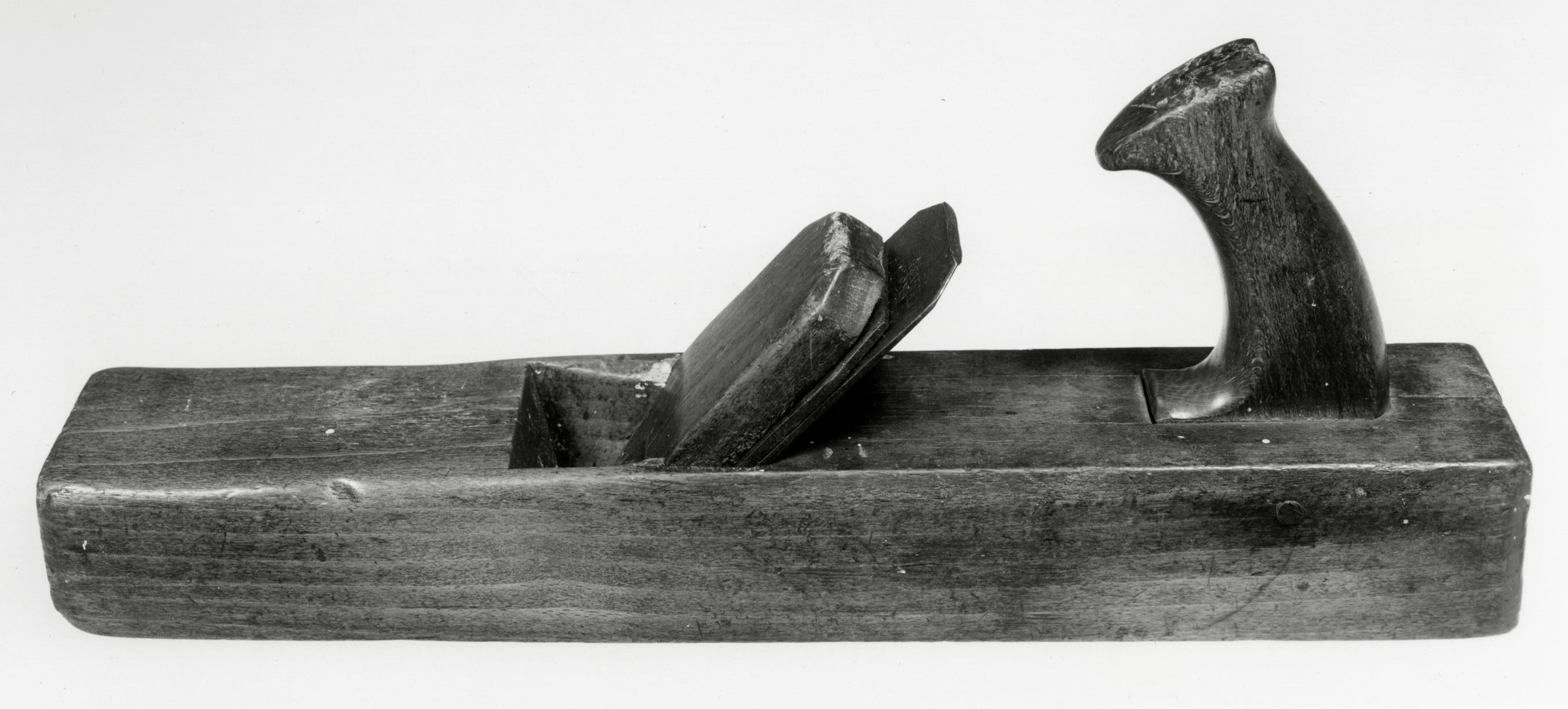 Black and white photo of a panel or strike block plane.