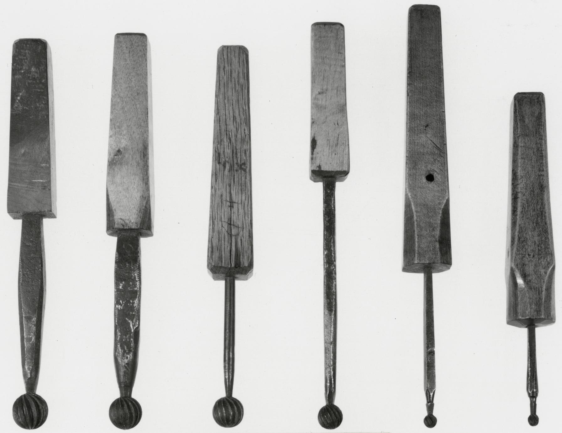 Black and white photograph of various reamer bits, or cherries.