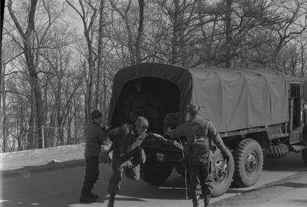 Soldier leaving military vehicle