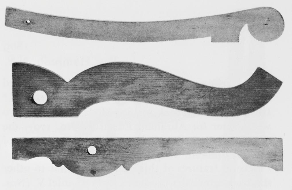 Black and white photograph of splat, cresting rail and armrest patterns.