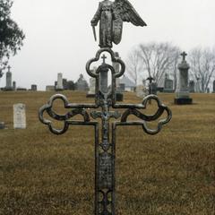 Cross with angel in Catholic graveyard