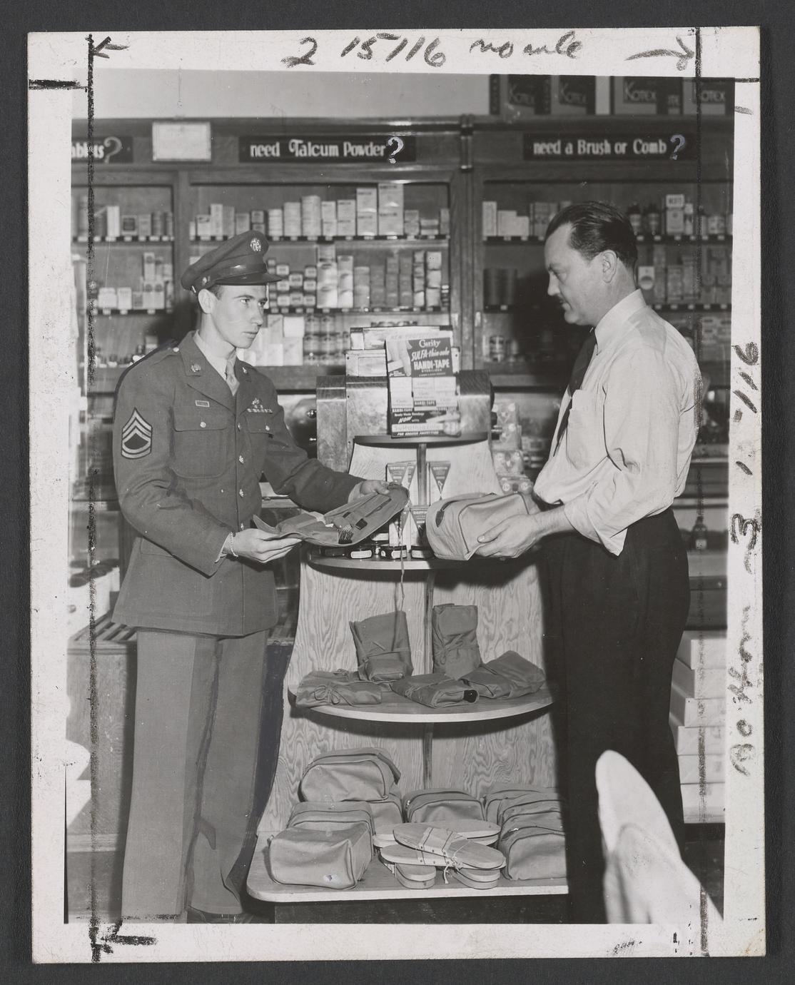 Two men stand near a toiletry display